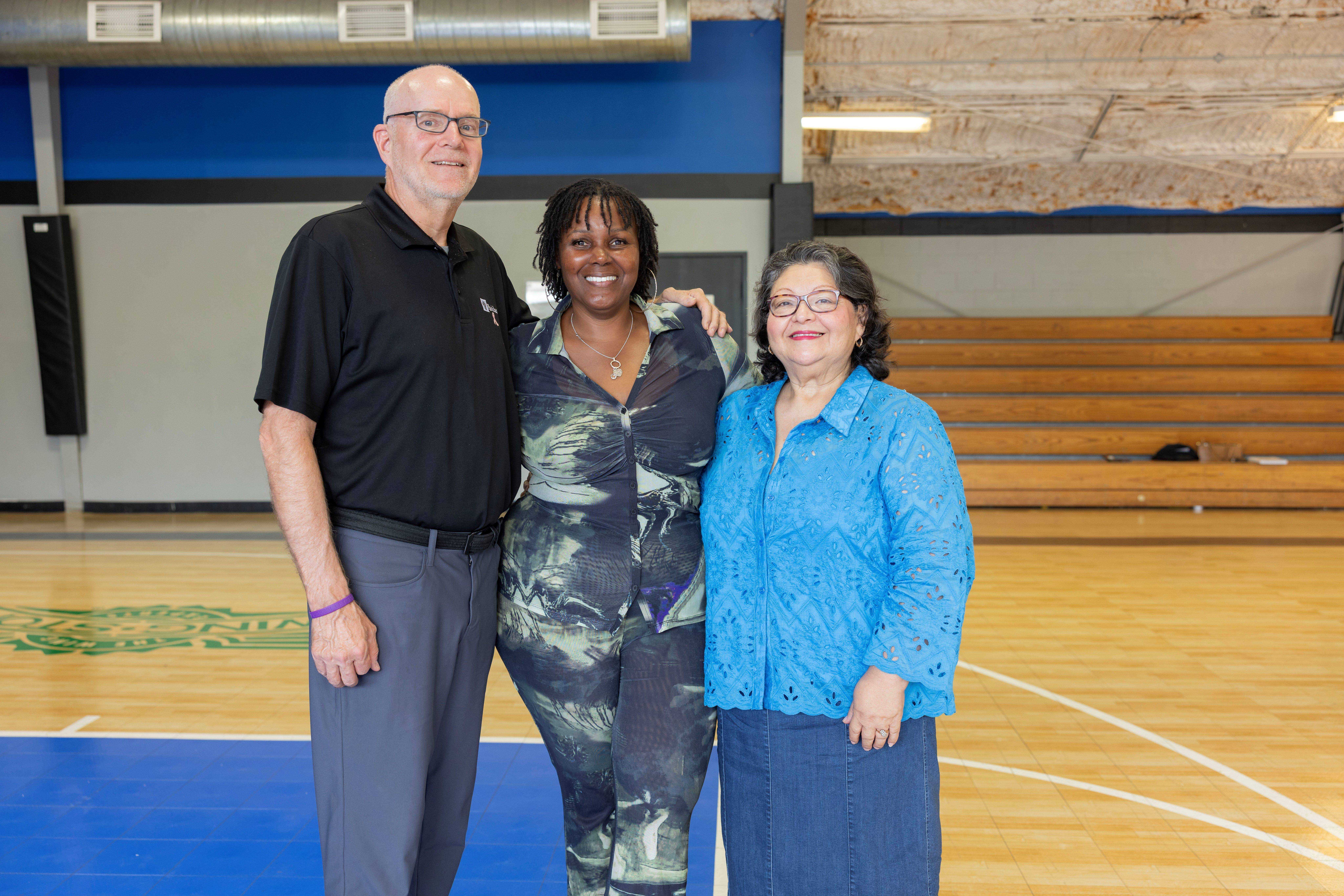 Harrington is pictured with Parkland Community Development Specialist Jeff Howard and Debbie Solis, Director of Family & Community Services at Voice of Hope.